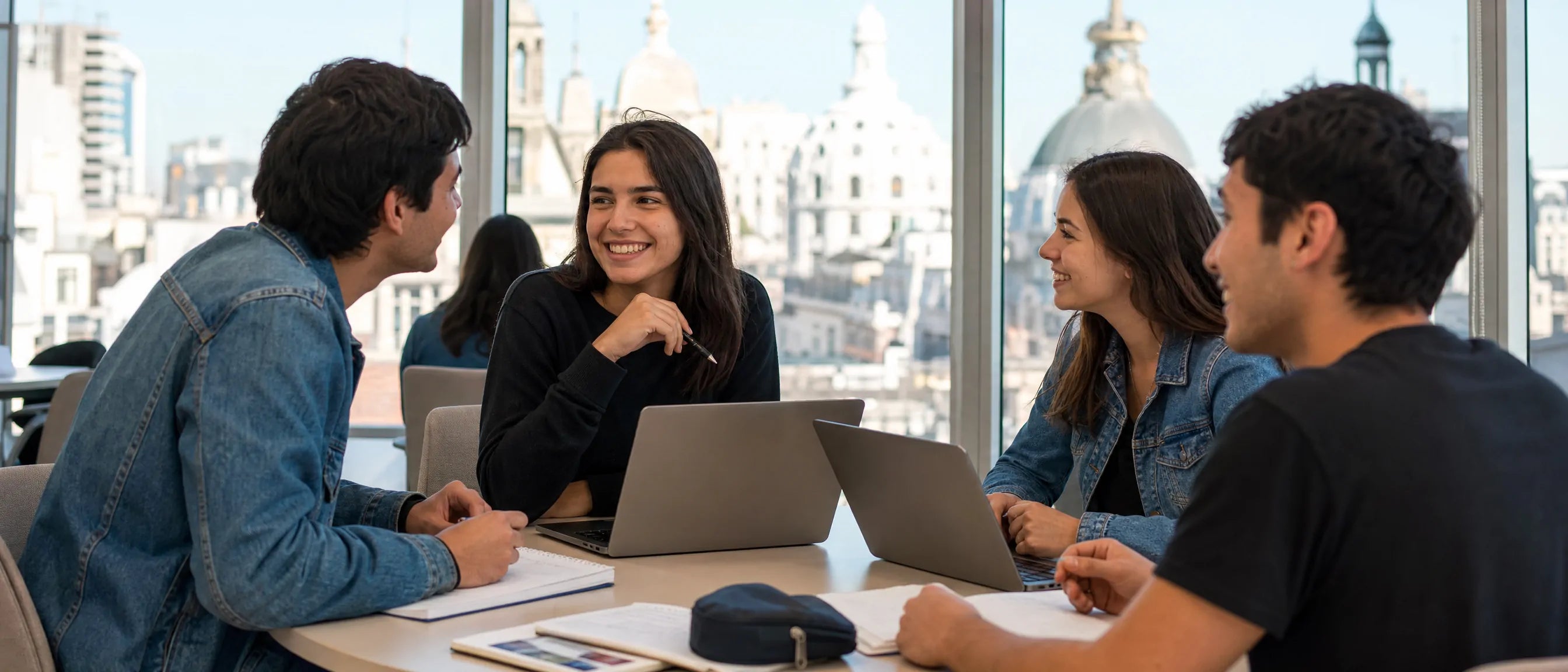 Collaborative learning furniture in Argentina with students studying together using laptops