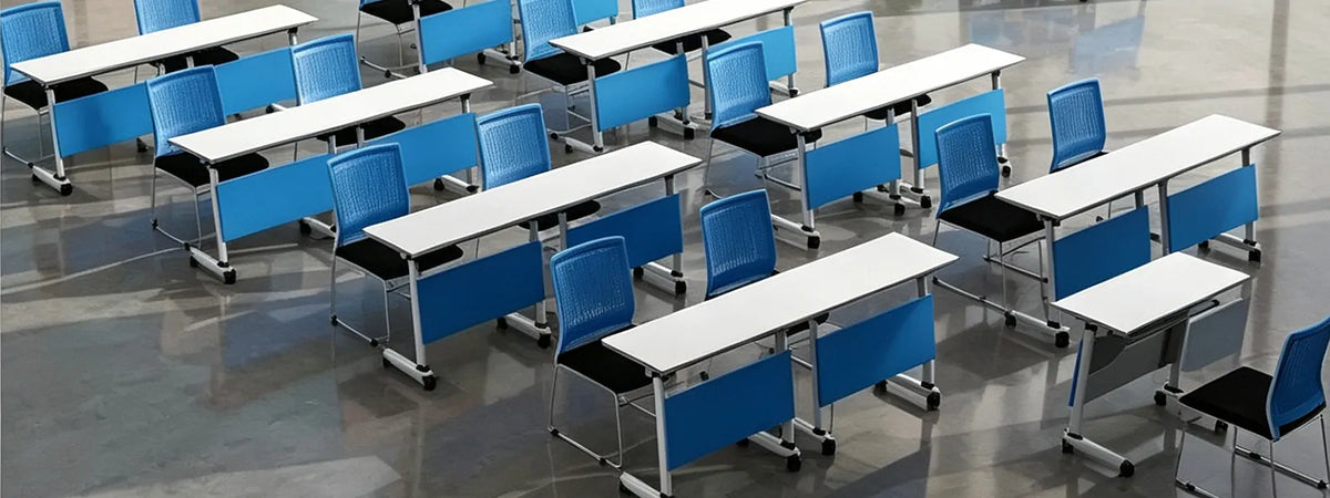 Multiple mobile flip top training tables arranged in classroom meeting room